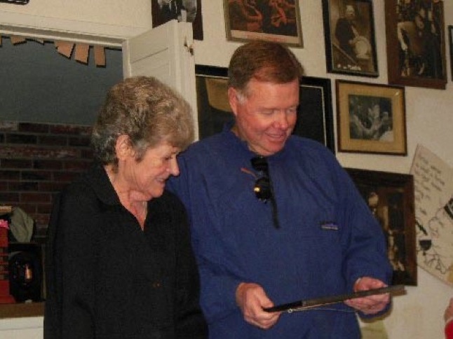 Carolyn Knight and Allen Fields viewing memorabilia.