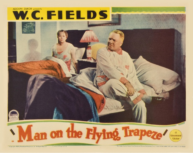 W.C. Fields rolling up his socks before bed in Man on the Flying Trapeze.