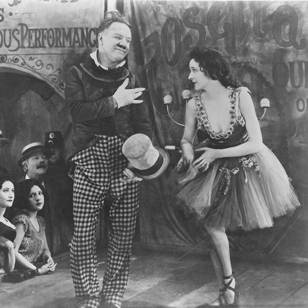Studio photo of W.C. Fields and Carol Dempster in Sally of the Sawdust.